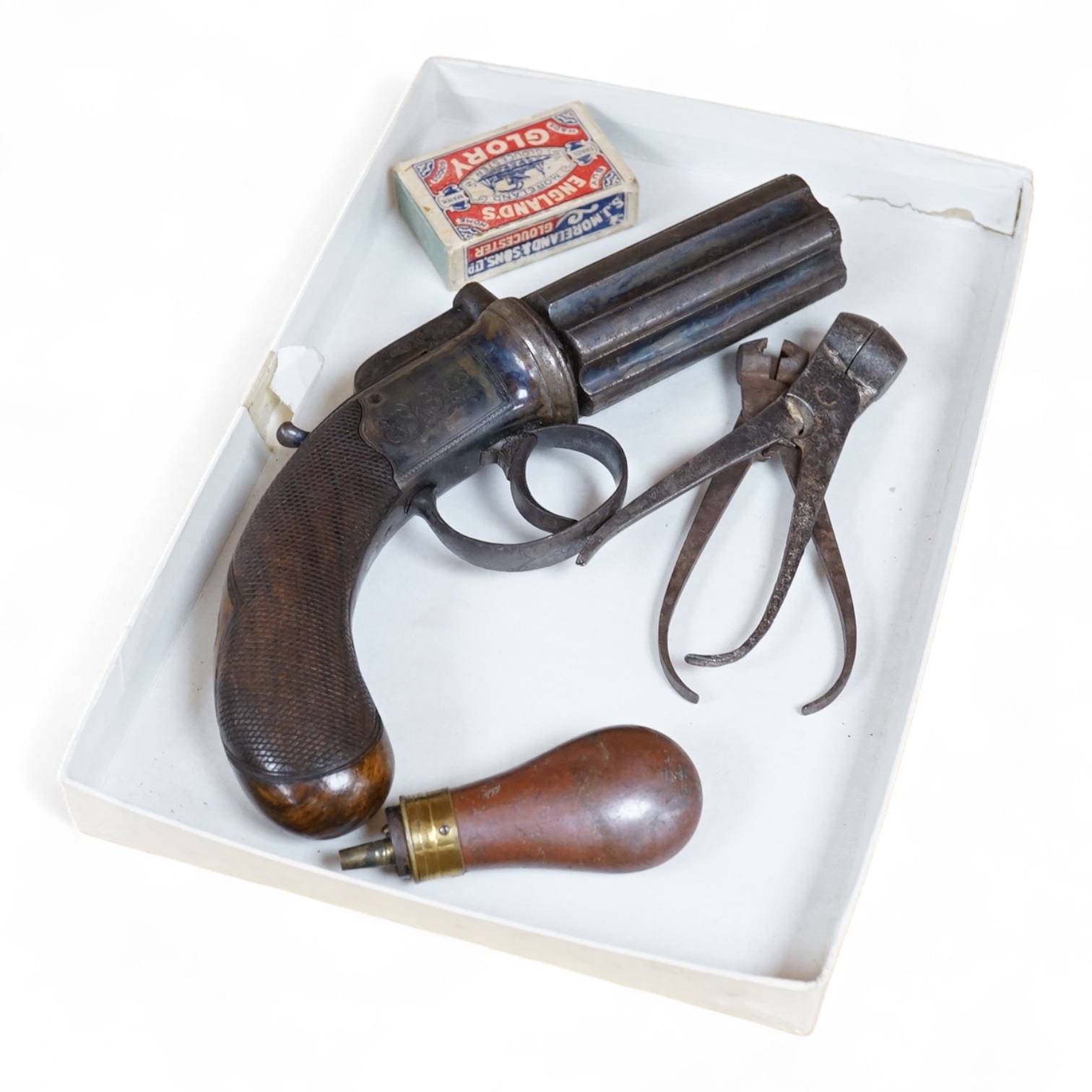 A six shot 80 bore, self-cocking, pepperbox revolver signed; W. Dooley, Liverpool, with foliate engraved frame and fluted barrel, Birmingham proved, and one piece rounded chequered walnut grip, together with a small copp